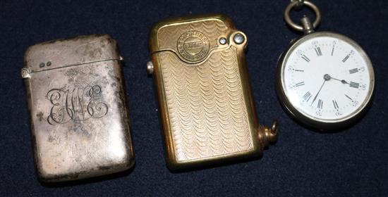 A silver pocket watch, a silver vesta and a gilt metal lighter.